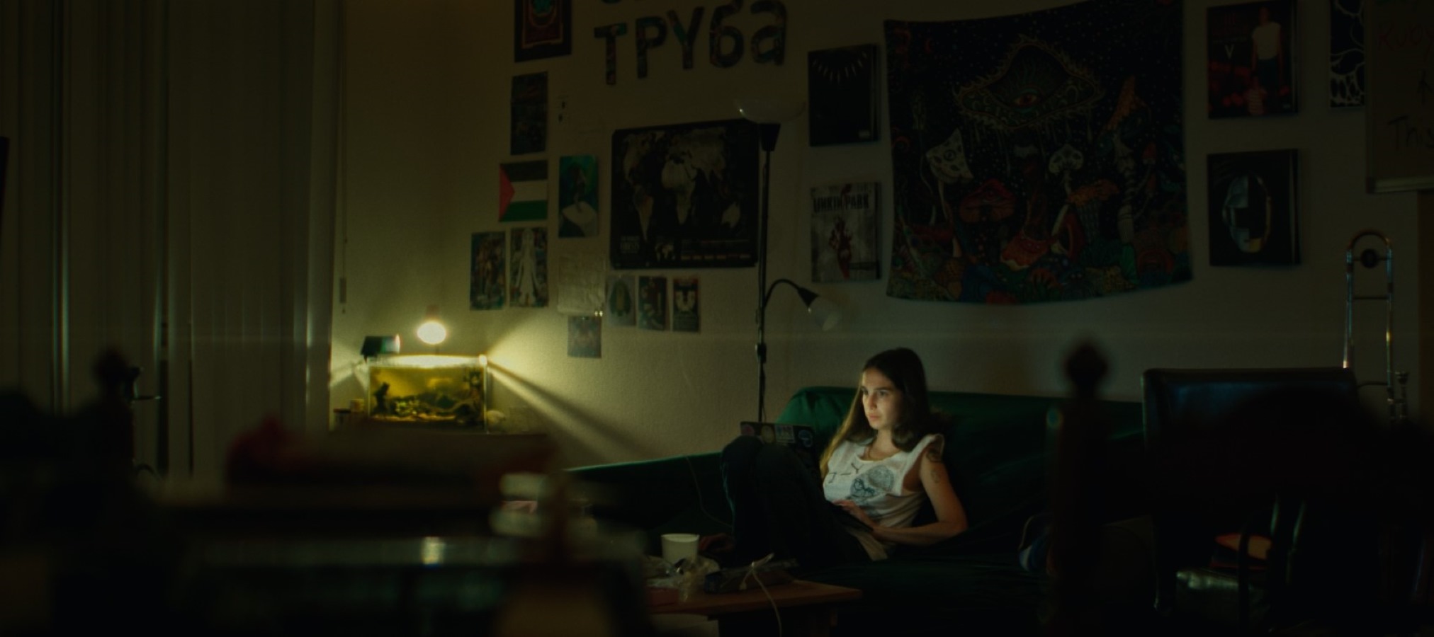 A woman looking at a computer in her living room